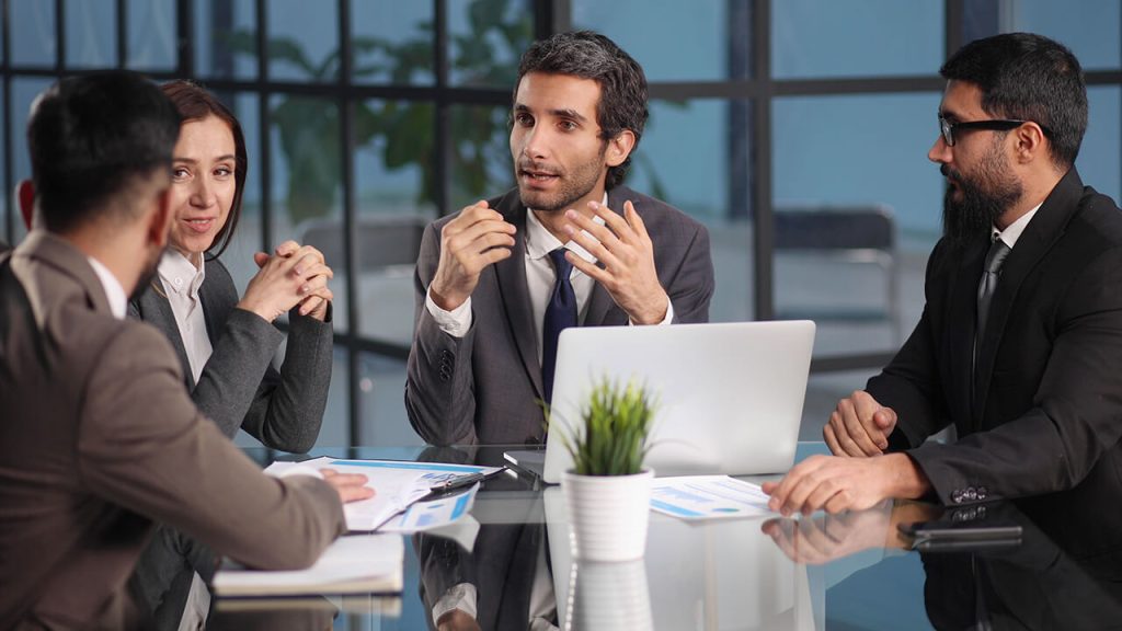 coworkers-gather-boardroom-discuss-ideas-group-briefing
