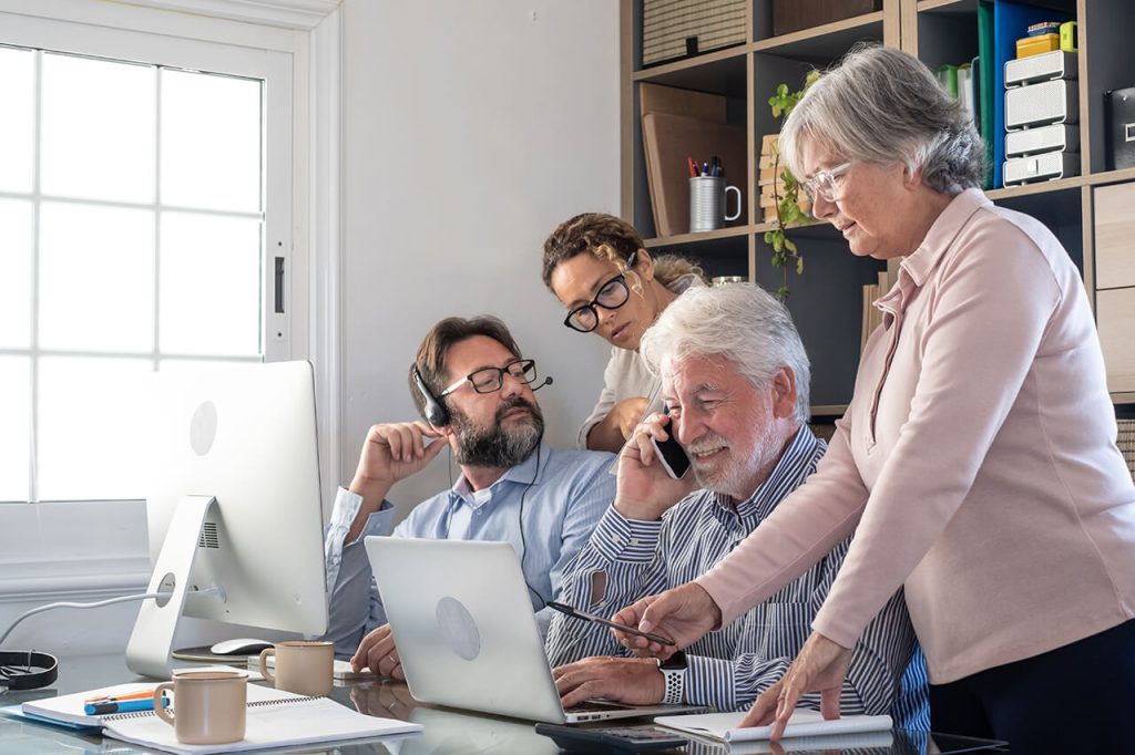 group-business-people-office-working-communicating-looking-laptop-computer