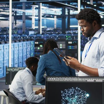 data-center-engineer-using-tablet-interpret-ai-generated-data-analytics-graphs