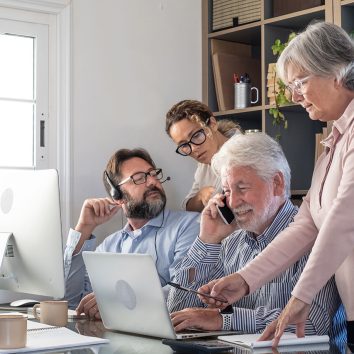 group-business-people-office-working-communicating-looking-laptop-computer